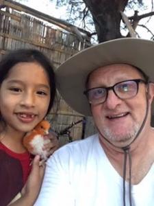 Equador Trip Paul with little girl and chick