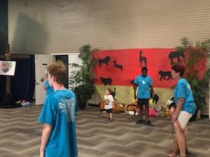 VBS Kids and teachers in sanctuary with jungle motif in background 8