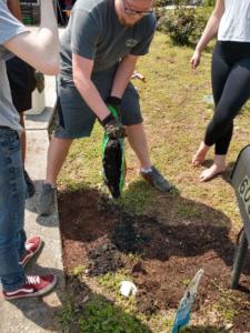 Youth Cleanup Philip opening potting soil