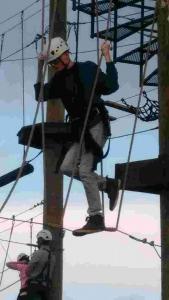 Youth Group young man getting on zip line
