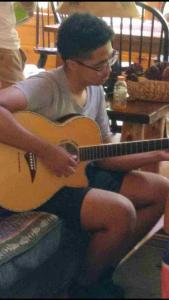 Youth Group young man playing a guitar