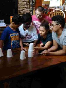 Youth group playing a game with cups